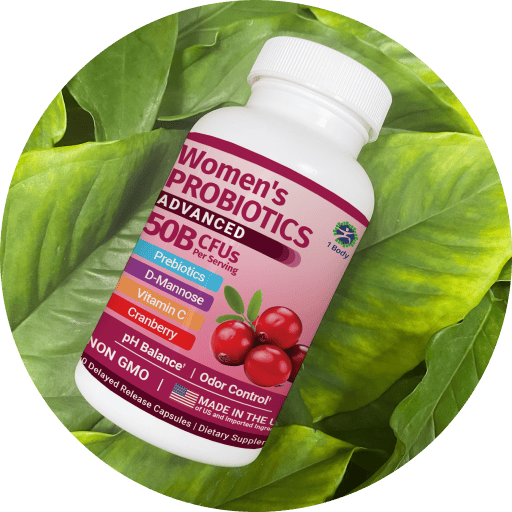 A bottle of Women's Probiotics 50B CFUs dietary supplement, displayed diagonally on a bed of fresh green leaves. The bottle is white with a pink and purple label featuring illustrations of cranberries.
